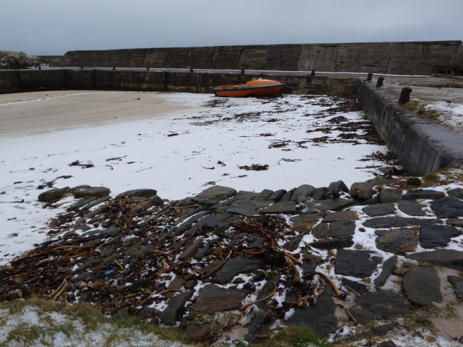 Snow on the beach at the Inner Harbour, Port of Ness